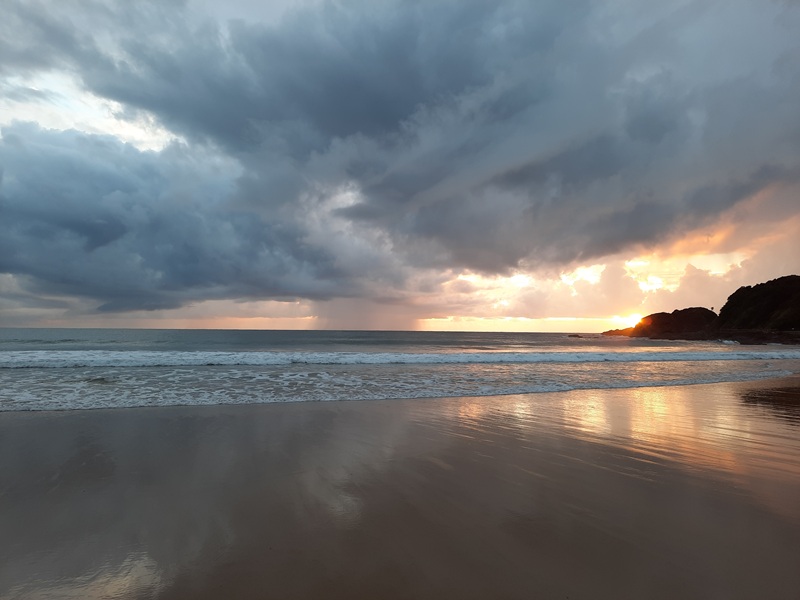 beach at sunrise with clouds