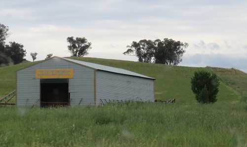 Farm shed with sign about Christmas