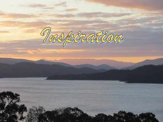 Word "inspiration" with sunset lake & mountains